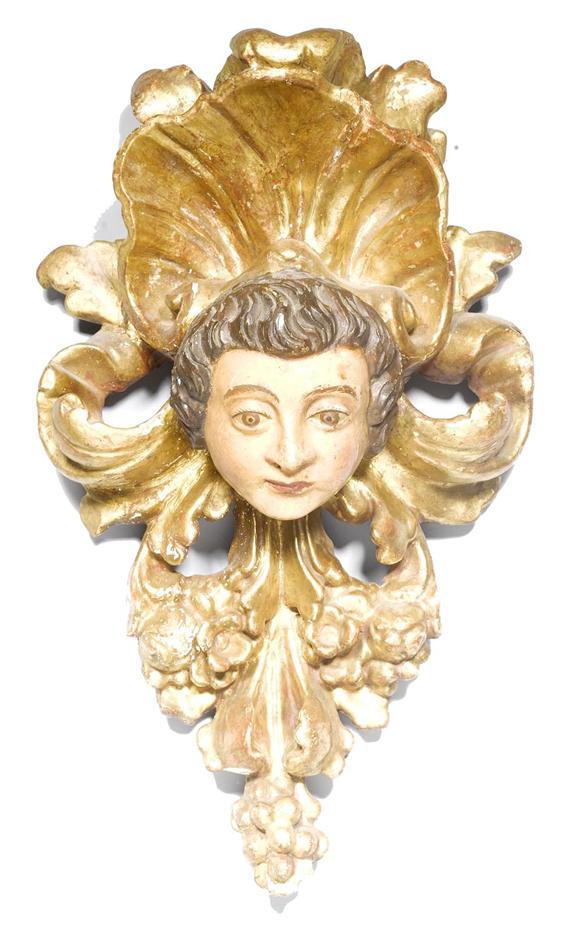 Appraisal: CARVED ANGEL'S HEAD IN A LEAF TENDRIL Baroque Spain th