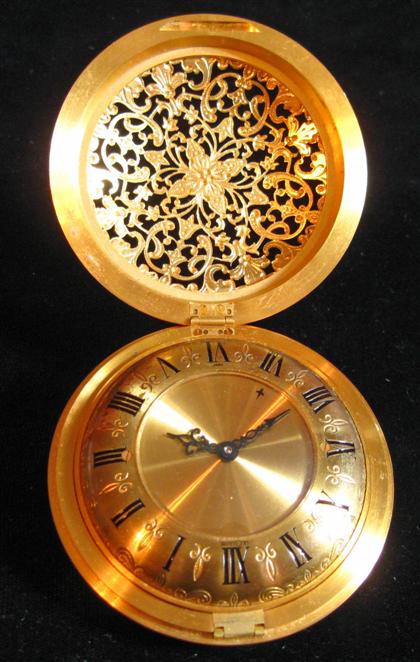 Appraisal: Circular gilt bronze folding travel alarm clockle coultre th century