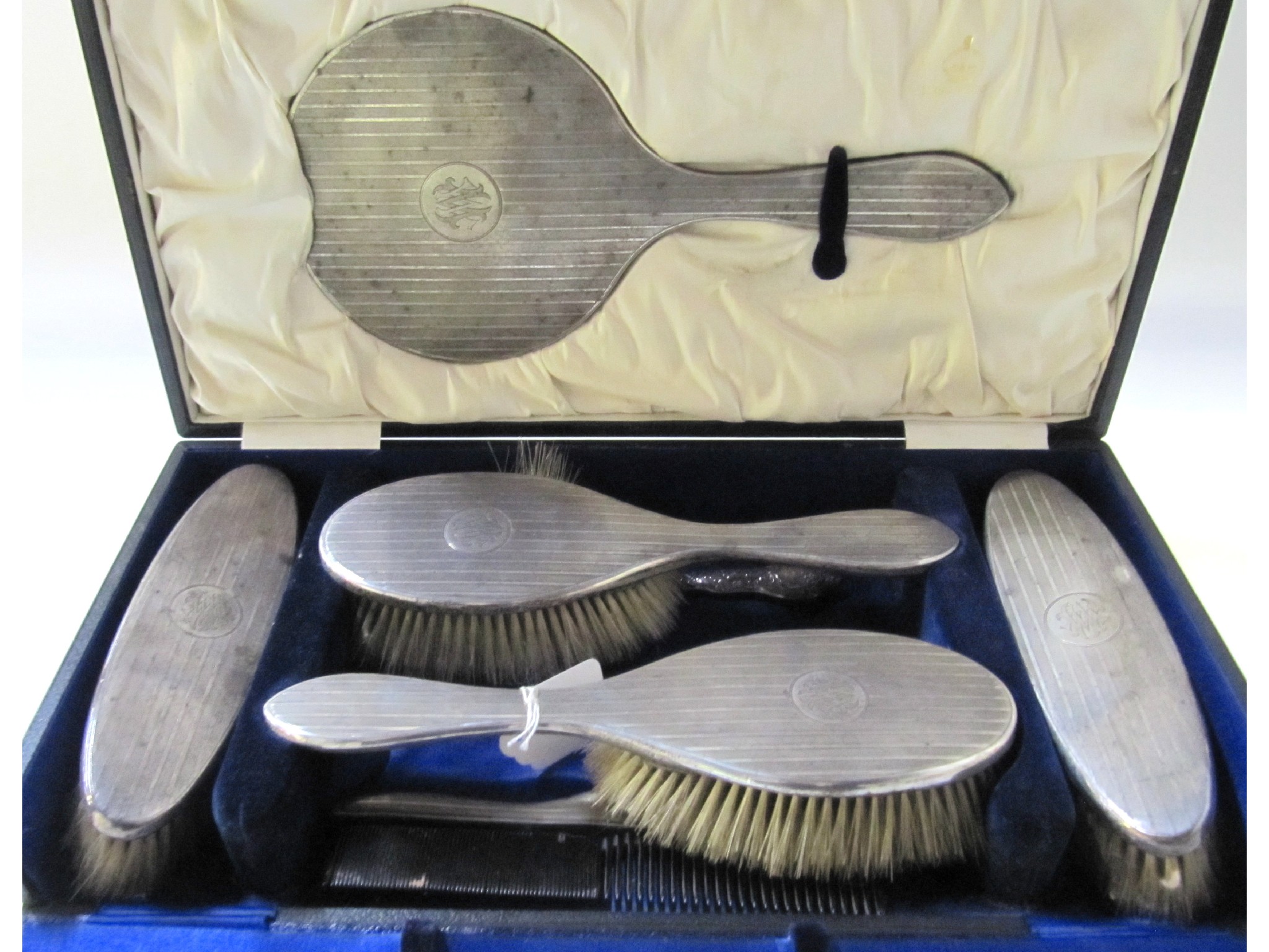 Appraisal: A cased six piece silver dressing table set Birmingham and