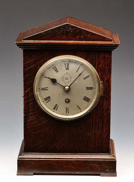 Appraisal: A RAF OFFICER'S MESS MANTEL TIMEPIECE the silvered Roman dial