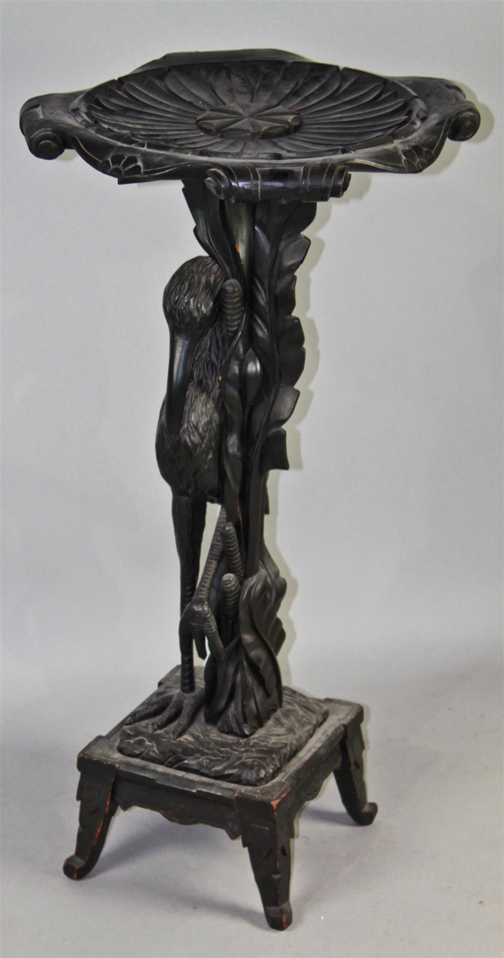 Appraisal: AESTHETIC MOVEMENT EBONIZED CARVED PEDESTAL STAND WITH FIGURAL STORK BASE