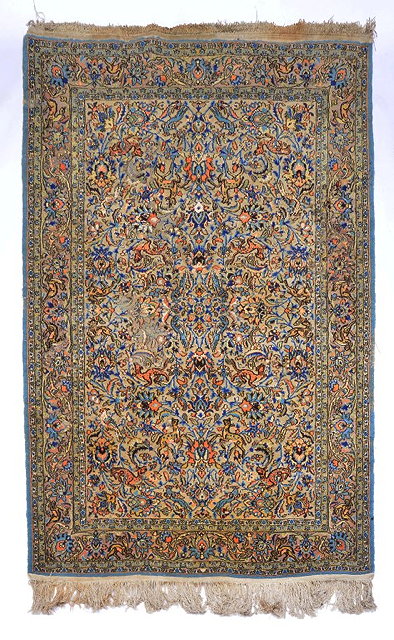 Appraisal: A PERSIAN KASHAN PASTEL GROUND RUG with all over scrolling