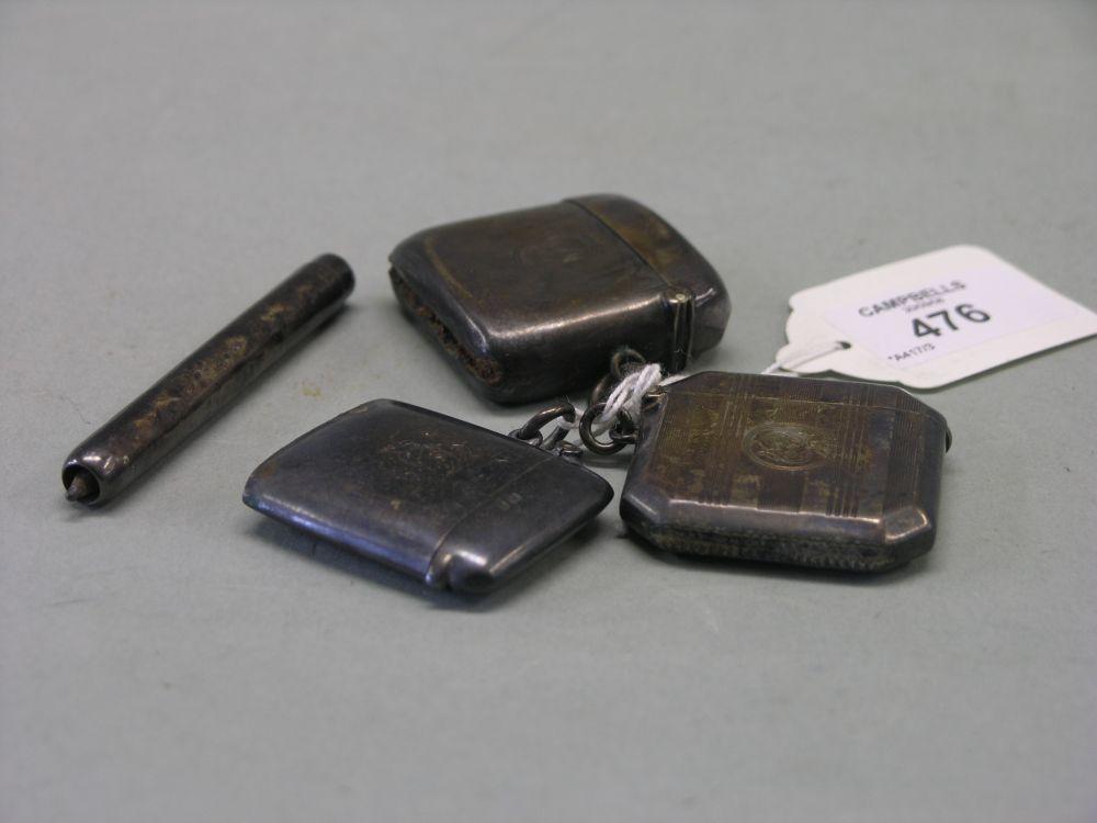 Appraisal: Three silver vesta cases and a silver pencil