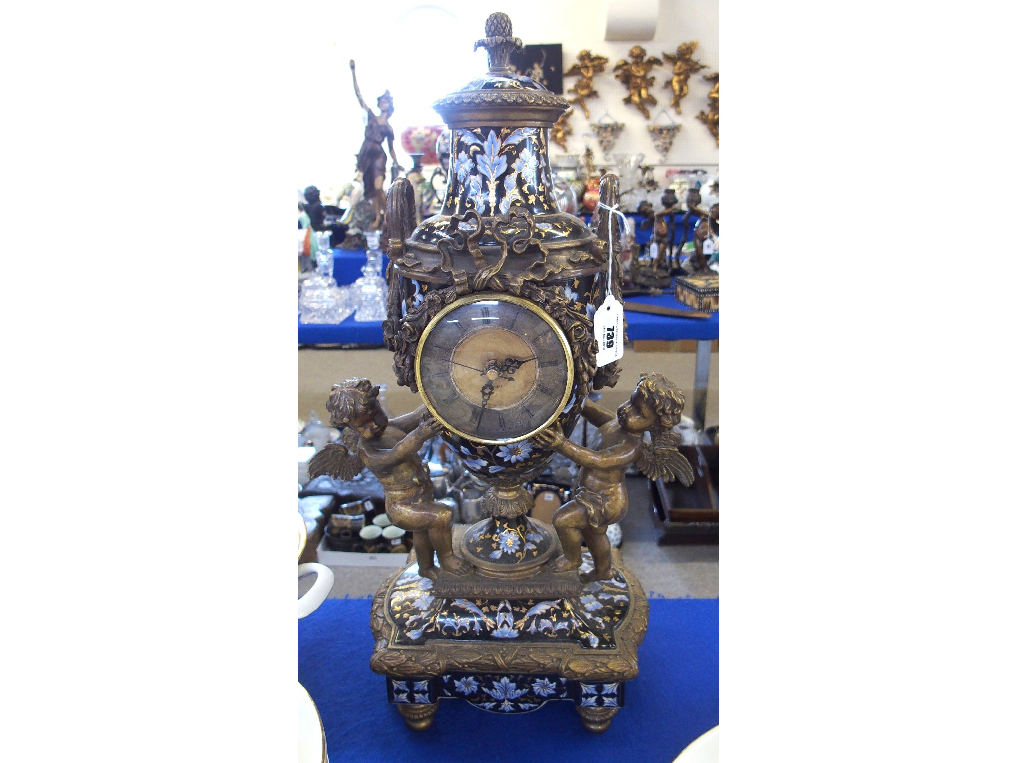 Appraisal: Porcelain urn shaped clock with gilt metal mounts and supported