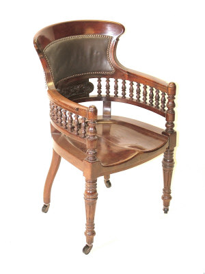 Appraisal: A late Victorian mahogany desk chair the shaped top rail