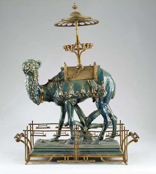 Appraisal: FABULOUS CAMEL FORM CIGAR HOLDER AND TOBACCO BOX A standing