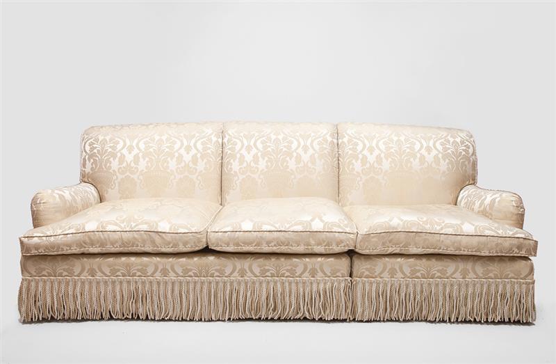 Appraisal: Two Cream Colored Damask Upholstered Sofas With four pillows ft