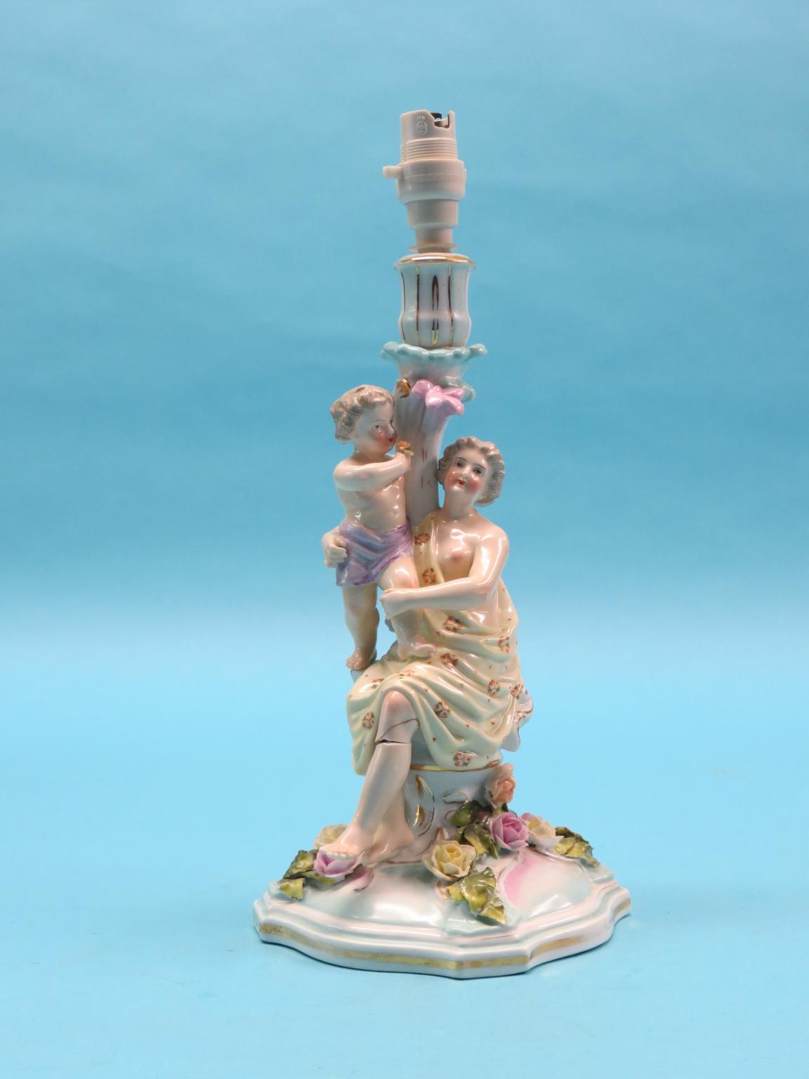 Appraisal: A th century Sitzendorf porcelain candlestick figure group maternal stem