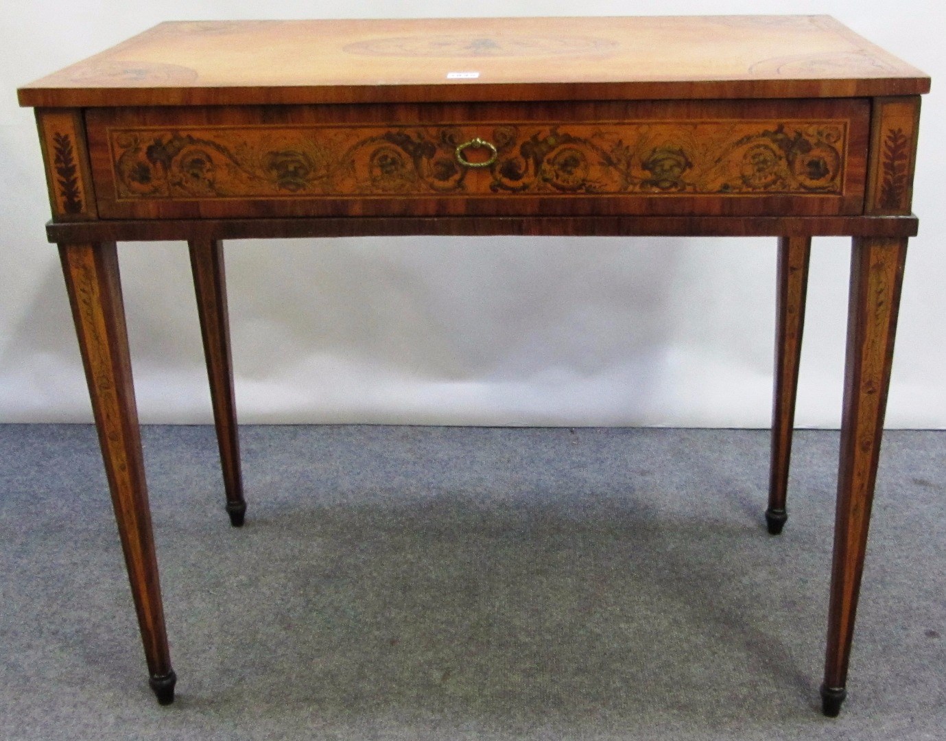 Appraisal: An th century marquetry inlaid Continental kingwood and satinwood rectangular