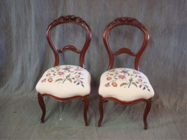 Appraisal: Pair of Victorian Balloon Back Chairs Carved with needlepoint upholstery