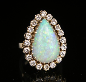 Appraisal: A Fine White Opal and Diamond Ring k yellow gold