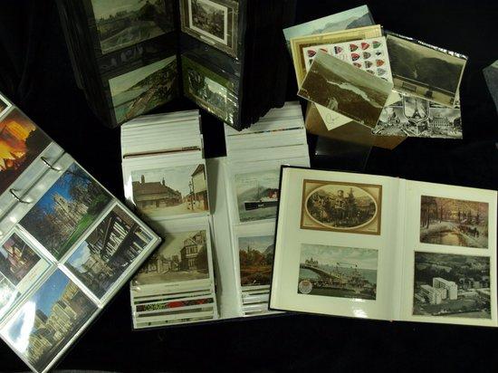 Appraisal: A collection of postcards in three albums and loose including