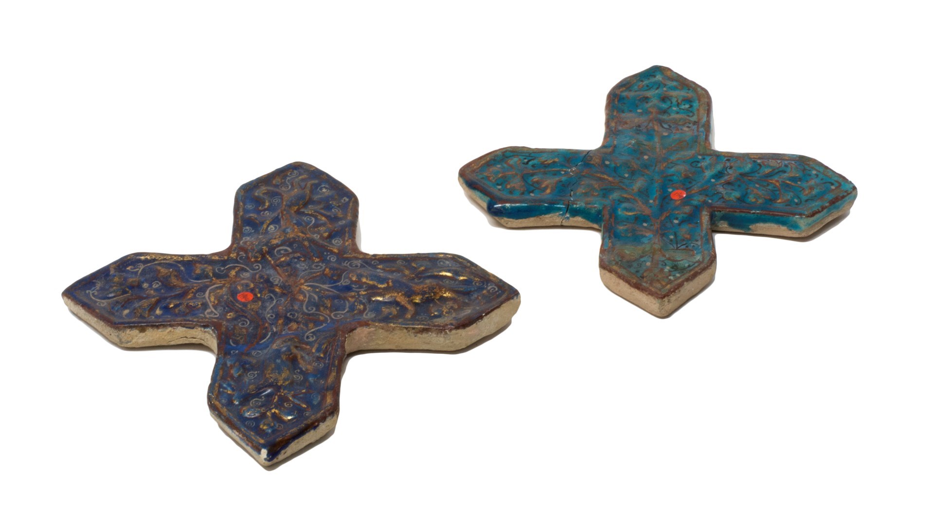 Appraisal: Two Persian ladjvardina pottery cross tiles circa th century one