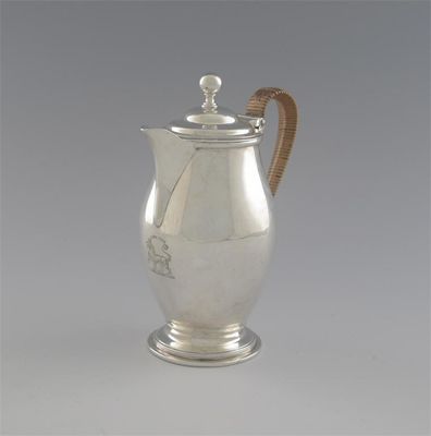 Appraisal: A George III baluster hot milk jug with cane-insulated handle