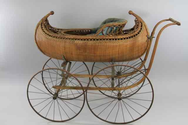 Appraisal: VICTORIAN CANOE FIGURAL BABY'S CARRIAGE Very rare example reed and