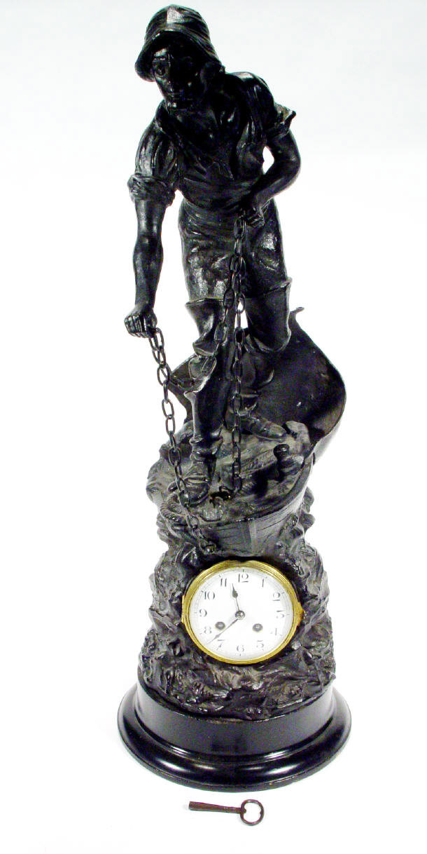 Appraisal: Large spelter cased clock modelled as a mariner throwing an