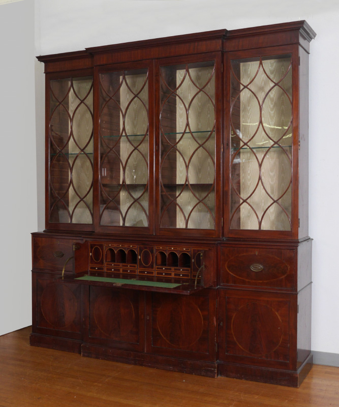 Appraisal: LARGE ENGLISH MAHOGANY BREAKFRONT CHINA CABINET Top with fretwork glass