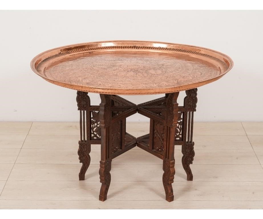 Appraisal: Indian copper round tray table with teak style carved base