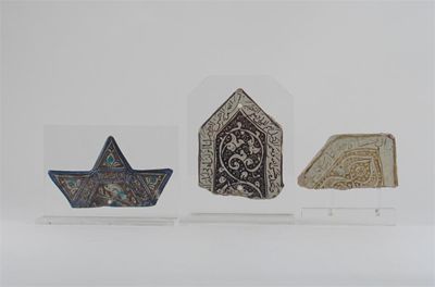 Appraisal: Three Middle Eastern tile fragments lustre decorated with stylized scrolls