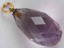 Appraisal: A Russian hallmarked faceted amethyst egg pendant with carat gold