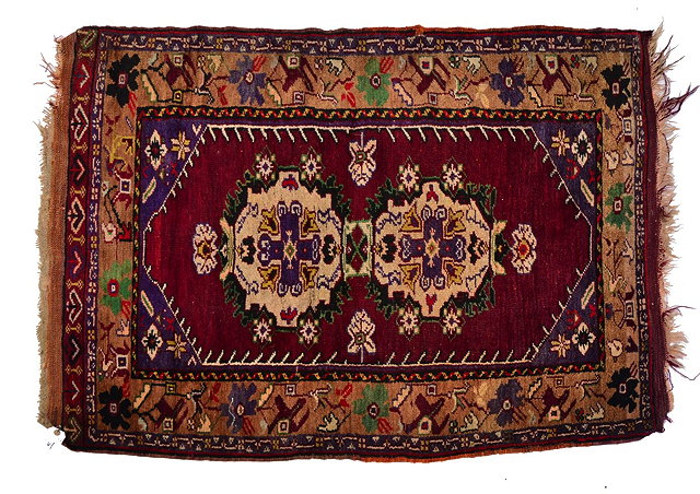 Appraisal: A TURKISH VILLAGE RUG with a central interlinking white ground