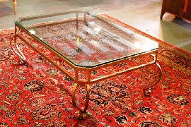 Appraisal: A gilted metal and glass topped coffee table