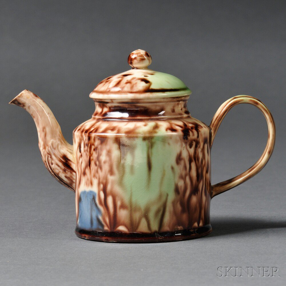 Appraisal: Staffordshire Cream-colored Earthenware Teapot and Cover England c cylindrical shape