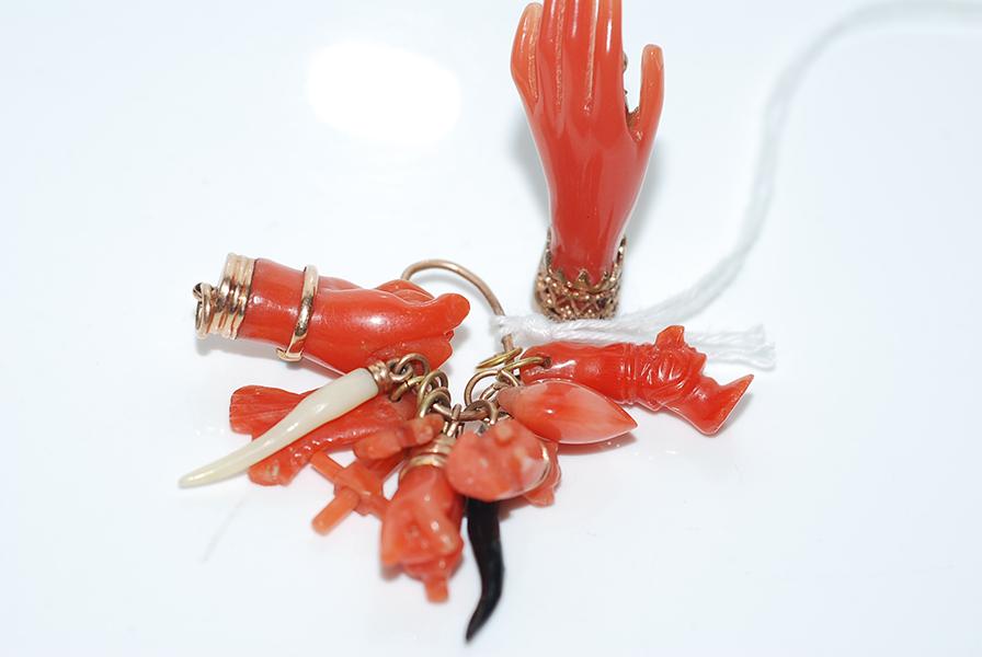 Appraisal: A CORAL CHARM PENDANT TOGETHER WITH A CORAL BROOCH A