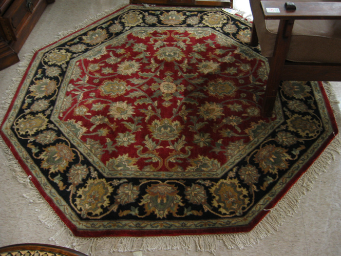 Appraisal: AN OCTAGONAL ORIENTAL AREA RUG Indo-Persian overall floral arabesque design