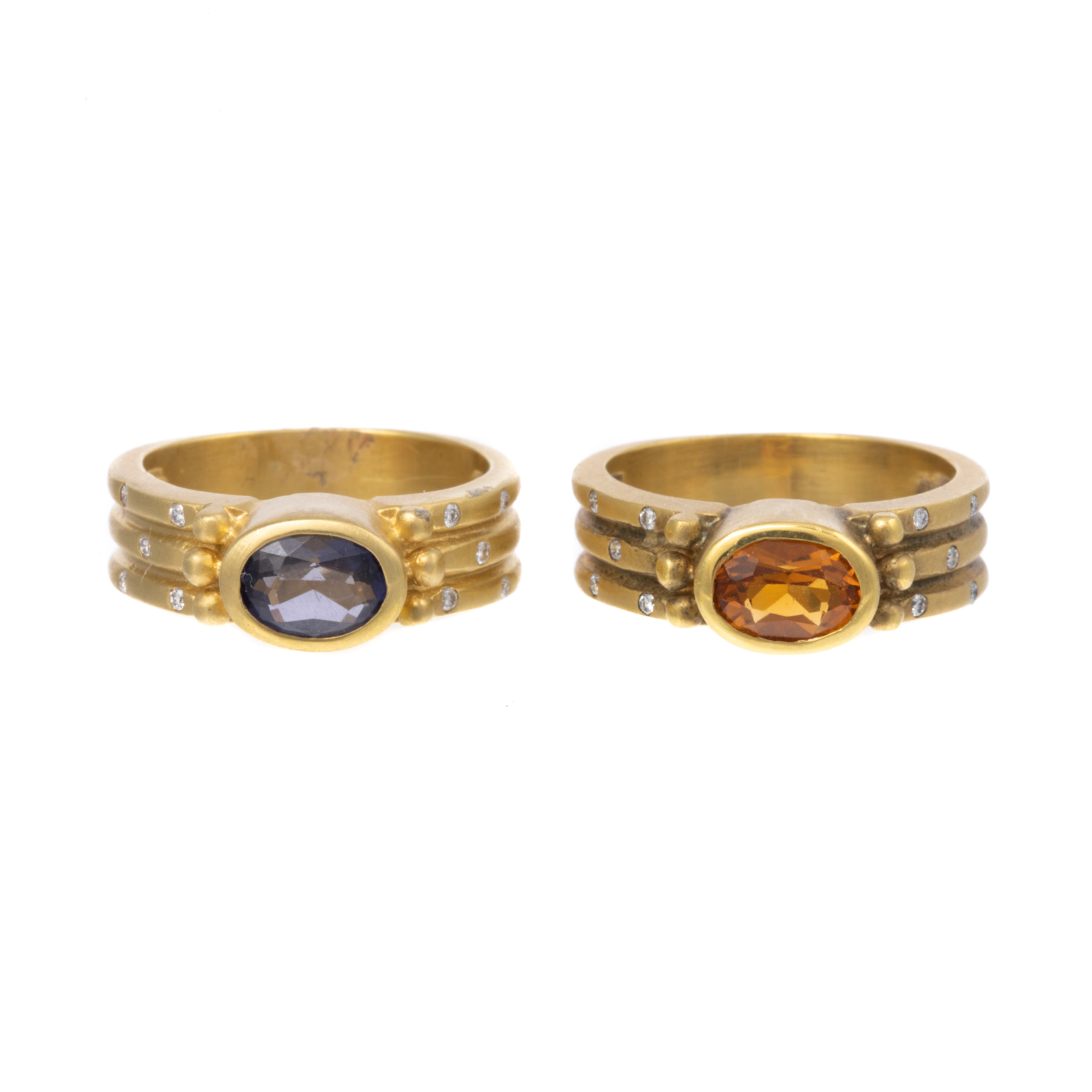 Appraisal: A PAIR OF BEZEL-SET CITRINE AMETHYST RINGS IN K K