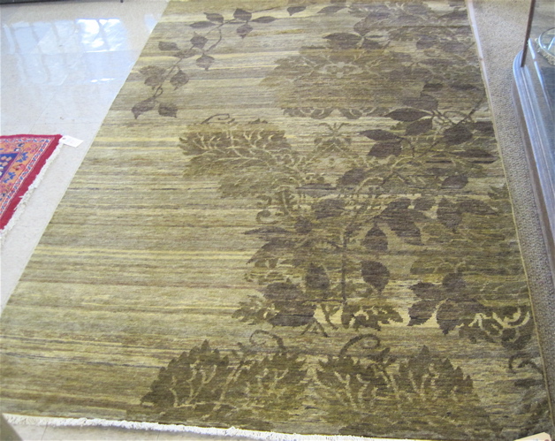 Appraisal: DECORATIVE HAND KNOTTED ORIENTAL CARPET hand knotted in a green