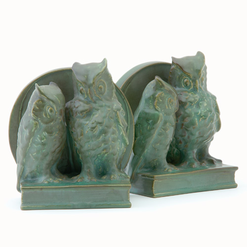 Appraisal: ROOKWOOD Pair of Production owl bookends designed by William McDonald