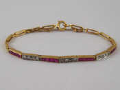 Appraisal: A yellow metal tests carat gold ruby and diamond bracelet