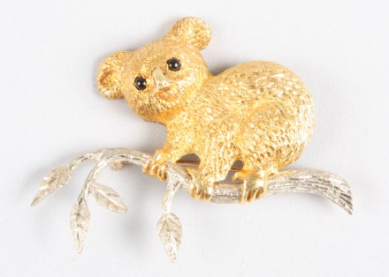 Appraisal: KTT yellow gold koala bear with cabochon eyes climbing white