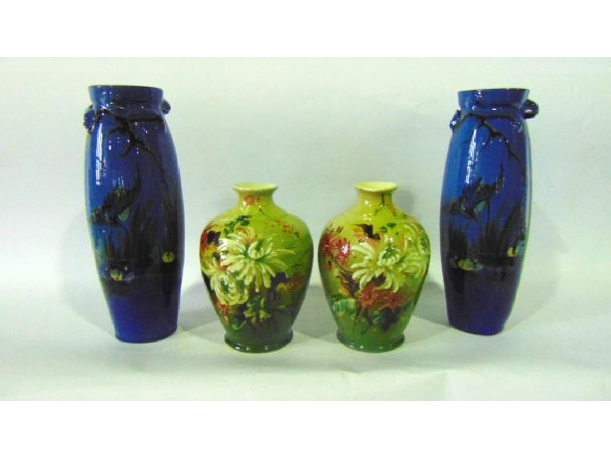 Appraisal: A pair of blue ground Torquay ware vases of slender