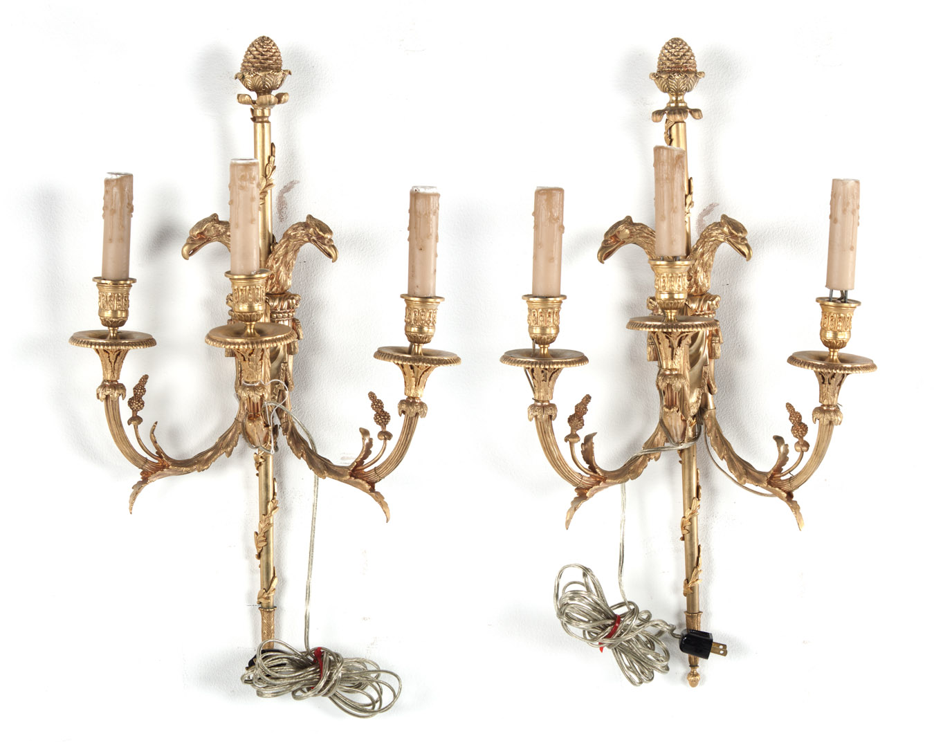 Appraisal: Pair of French Empire style gilt-bronze sconces with double eagle