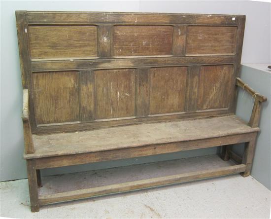 Appraisal: th century oak settle with panelled back scroll arms and