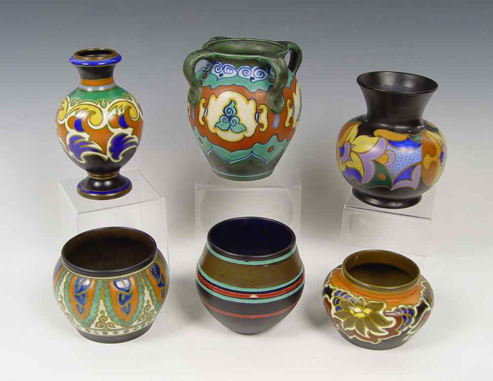 Appraisal: SIX GOUDA POTTERY VASES AND JARDINIERE Collier pattern jardiniere ''