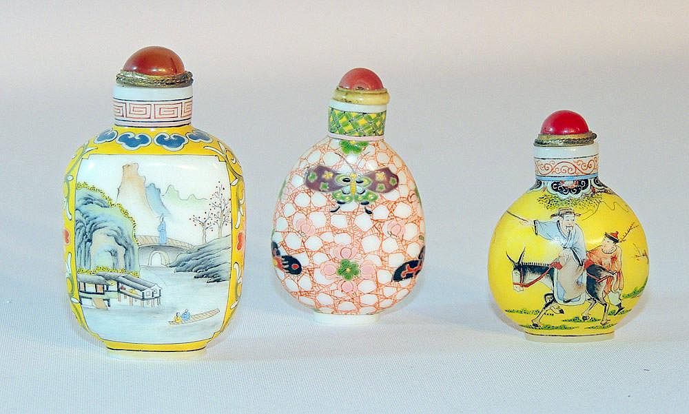 Appraisal: Three Glass Snuff Bottles Three glass snuff bottles each with