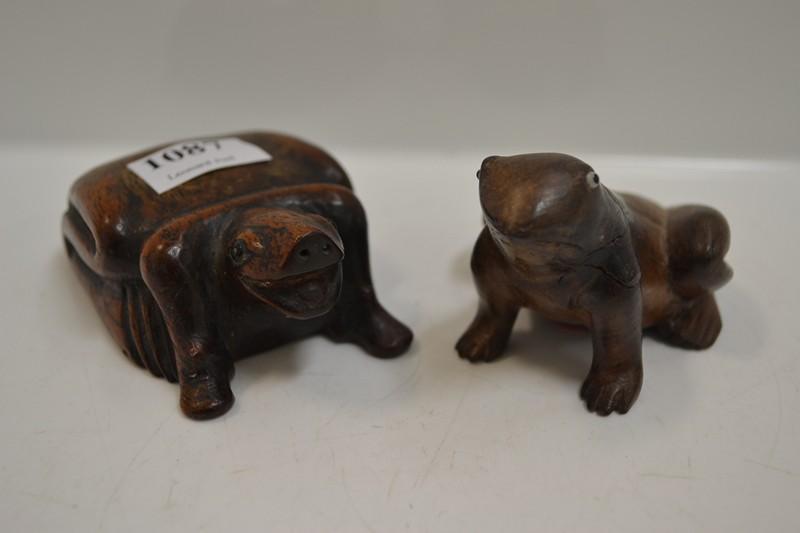 Appraisal: TWO SMALL WOOD CARVED ANIMALIA FIGURES