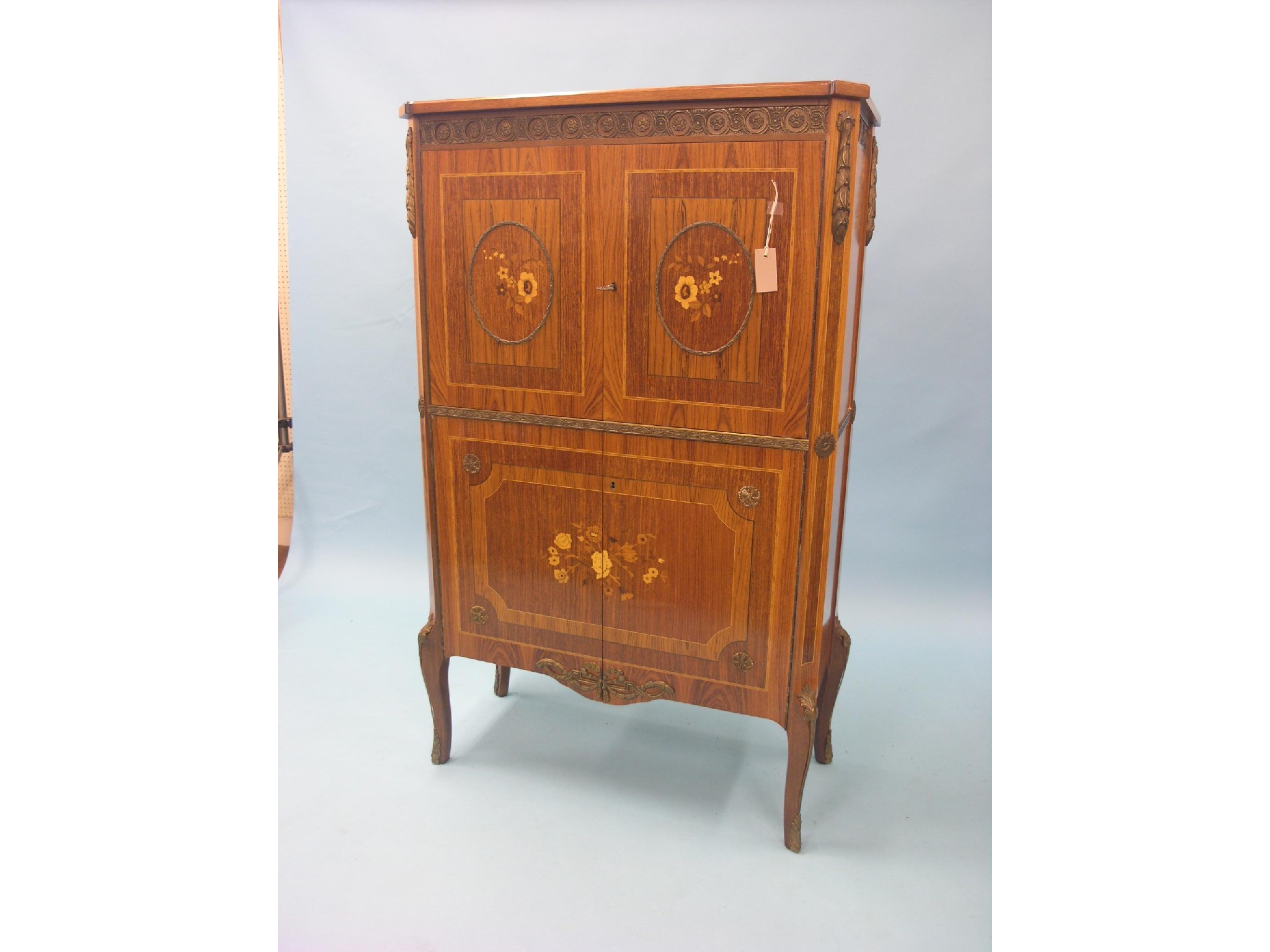 Appraisal: A French transitional-style kingwood drinks cabinet pair of doors enclosing