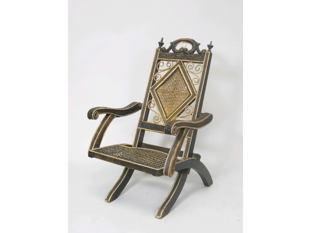 Appraisal: A Child's Victorian Folding Chair in cane and carved wood