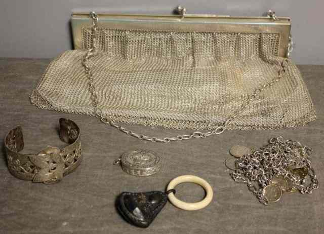 Appraisal: Silver Lot Includes an silver oversize mesh purse with original