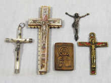 Appraisal: A mixed lot comprising four crucifixes and an icon