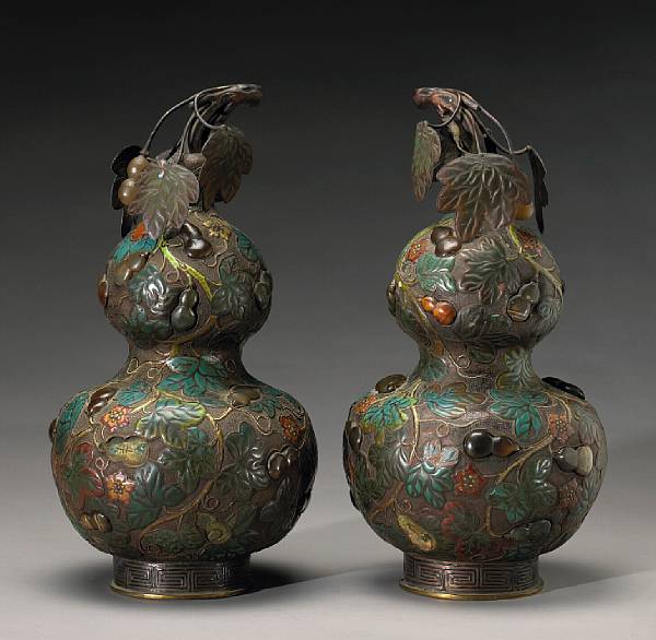 Appraisal: A pair of enameled copper alloy double gourd covered jars