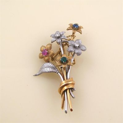 Appraisal: A gem set floral spray brooch the two colour mount