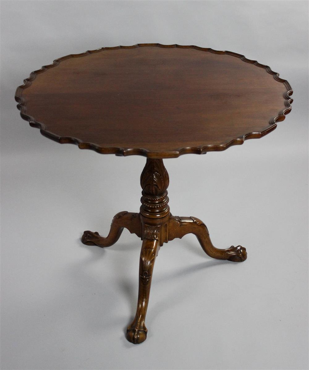 Appraisal: CHIPPENDALE STYLE CARVED MAHOGANY PIECRUST TEA TABLE having a piecrust