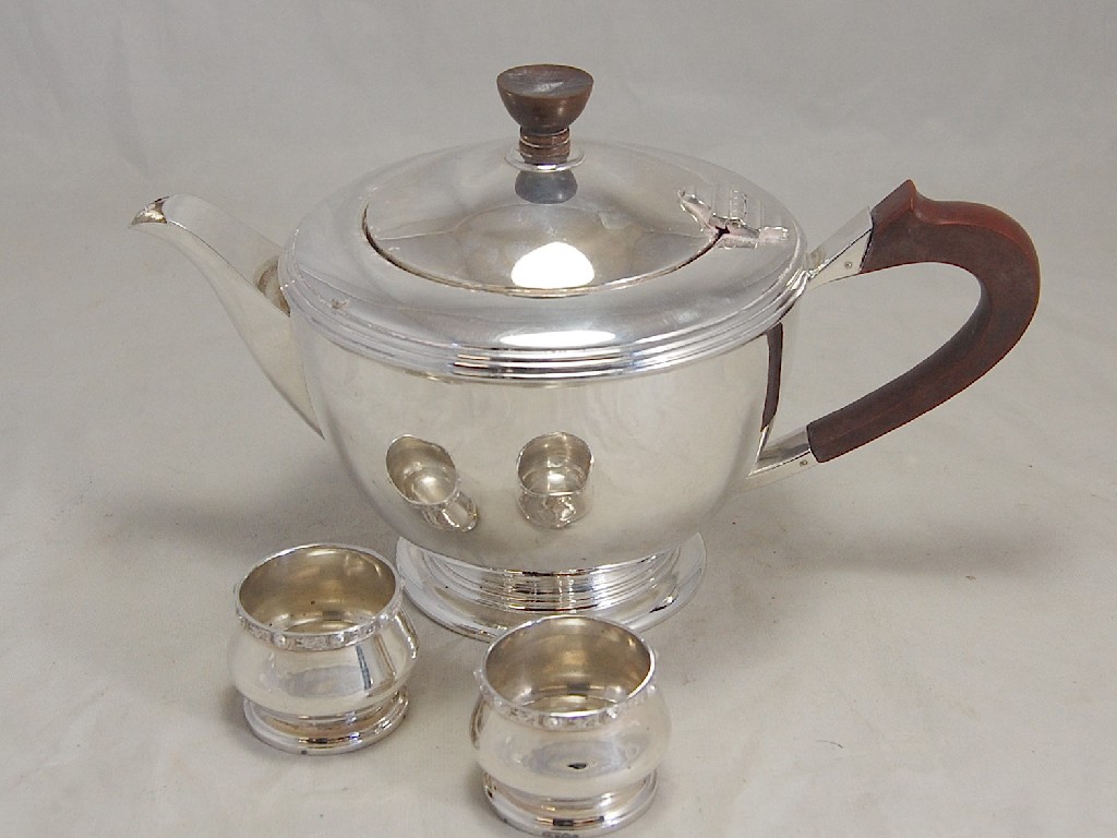 Appraisal: Silver teapot on circular stemmed foot Birmingham to w a