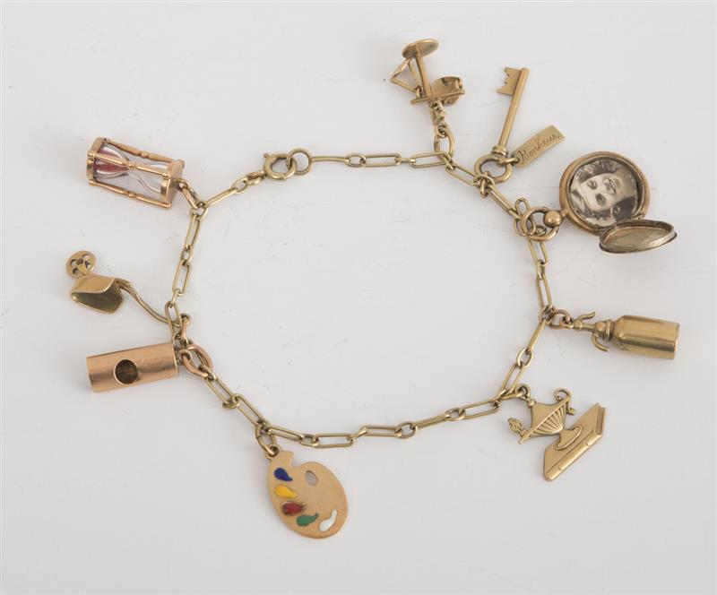 Appraisal: K YELLOW GOLD CHARM BRACELET With various charms one containing