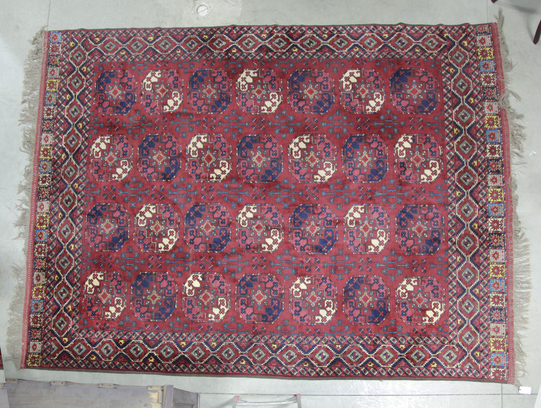 Appraisal: HANDMADE ROOMSIZE BOKHARA RUG Asian mid- th century Wool with